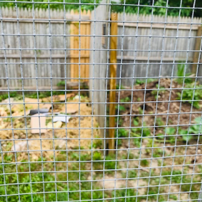 old fencing sections to create three sided open compost pits
