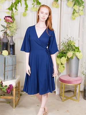 Woman wearing blue dress from Ash and Rose