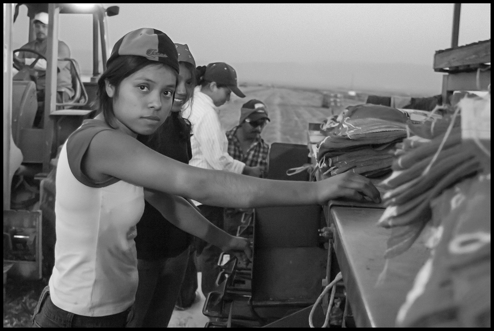 teen girl works farm machine