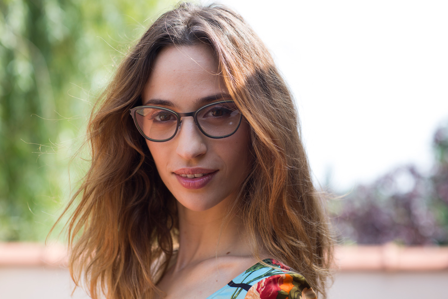 Model wearing SKA148 glasses from Nature Eyes made from recycled titanium and plant-based plastic.