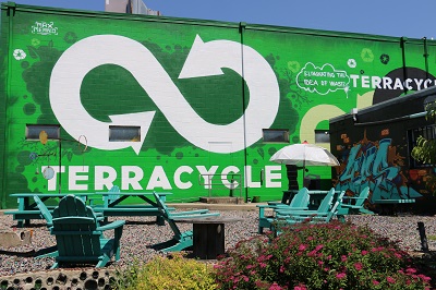 terracycle courtyard with infinity sign mural