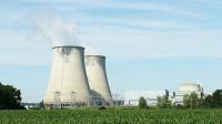 Image: nuclear energy plant smokestacks.