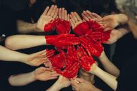 peoples hands together as a heart