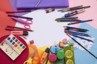 Image: colorful art supplies laid out on table. Topic: Are Your Art Supplies Toxic?