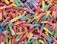 Image: colorful gummy worms. Title: The Sweet Side of Fair Trade 