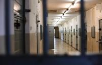 a prison hallway; financing of prisons is a problem of big banks