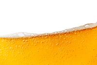 top of a glass of golden beer