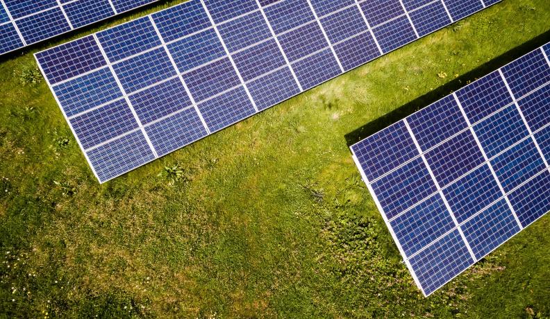 Image: overhead view of solar panels. Topic: Could the World be Powered Fully by Renewable Sources?