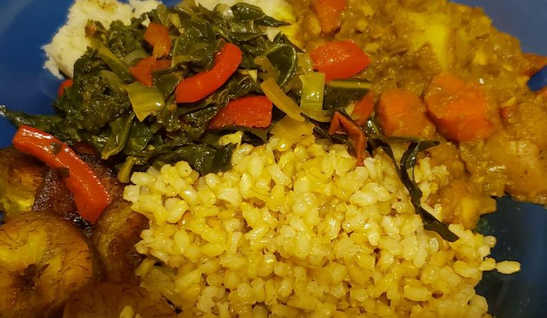 Curry chickpeas, brown rice, collard greens, fried plantains and mashed green banana