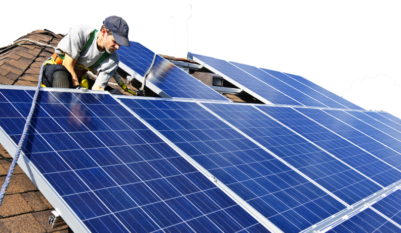 solar technician installing solar panels on a roof