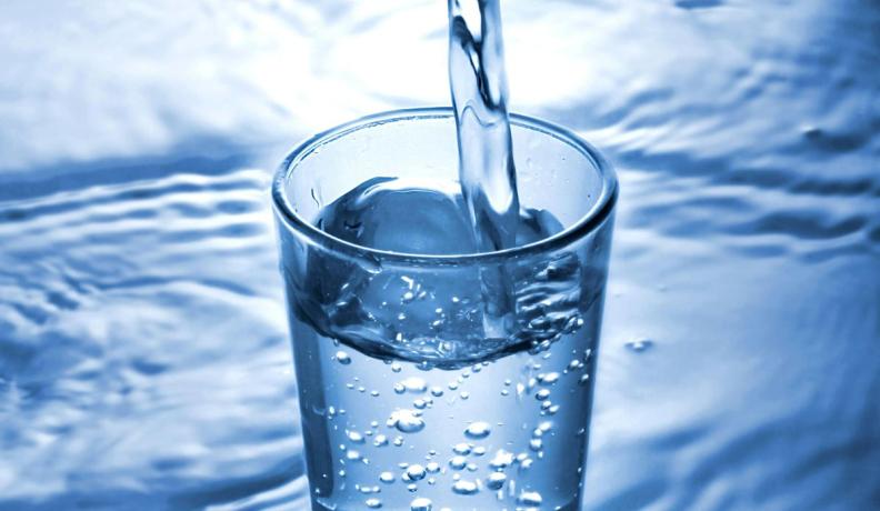 abstract photo of water being poured into a clear glass