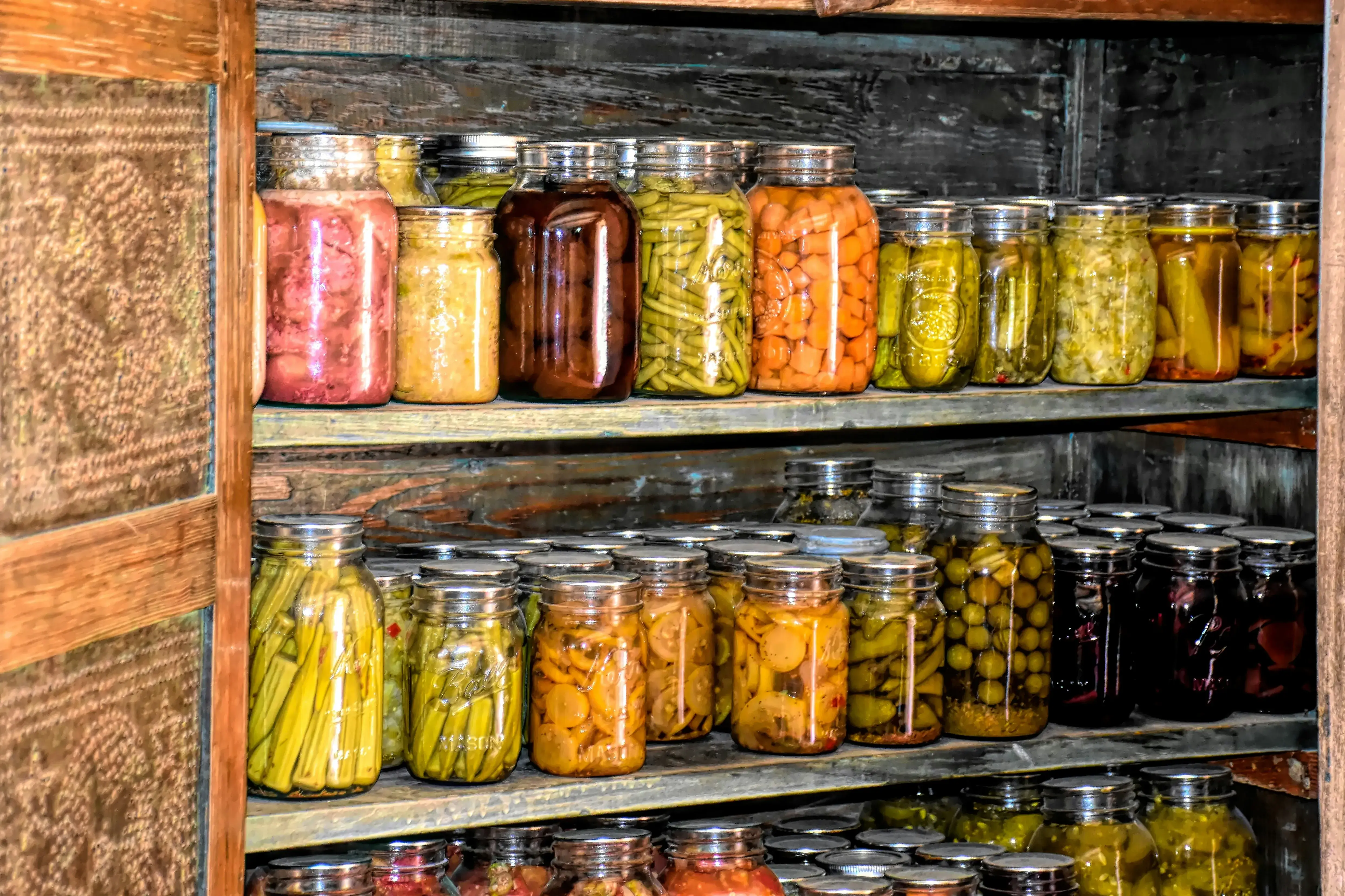 Rows of home-canned goods on shelves.
