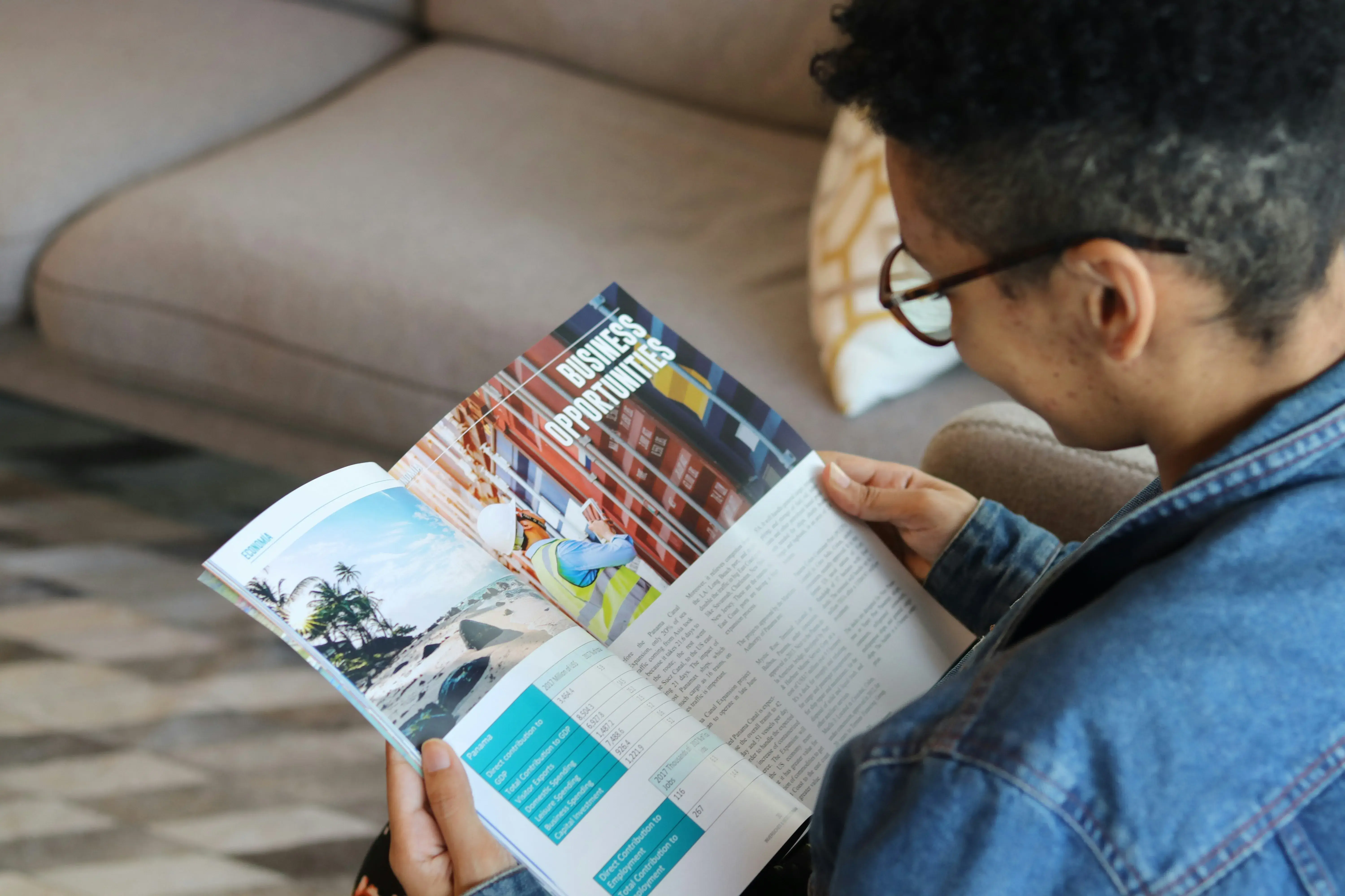 generic photo of a person reading a print magazine