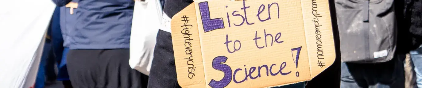 listen to the science. Photo by Mika Baumeister on Unsplash