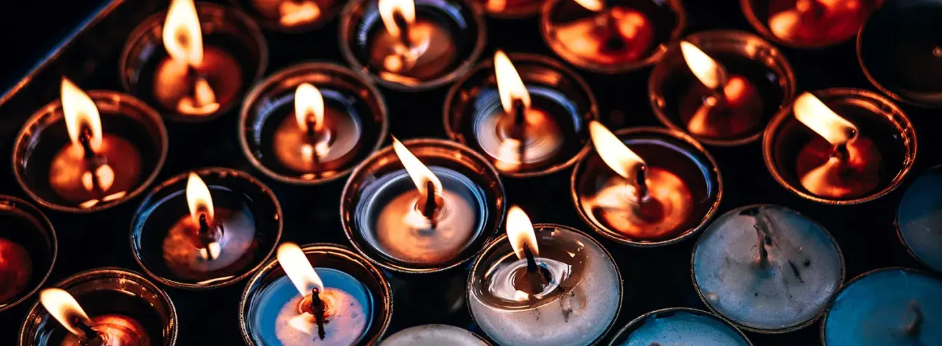 Image: tea lights burning. Topic: Most Popular Green Living Tips