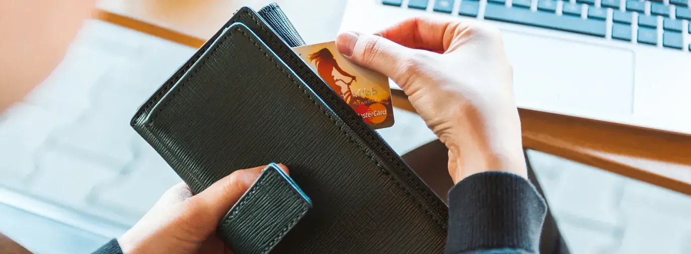 pulling credit card out of wallet