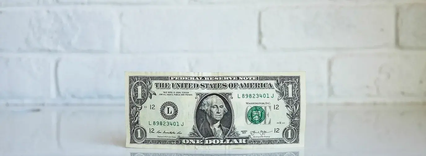 Image: one dollar bill. Topic: How a $25 Small Loan Can Change the World 