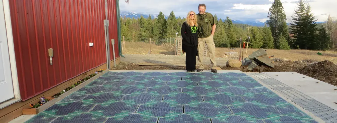 Scott and Julie with a smart road in a parking lot