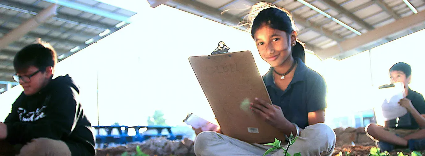 girl working at Arizona garden