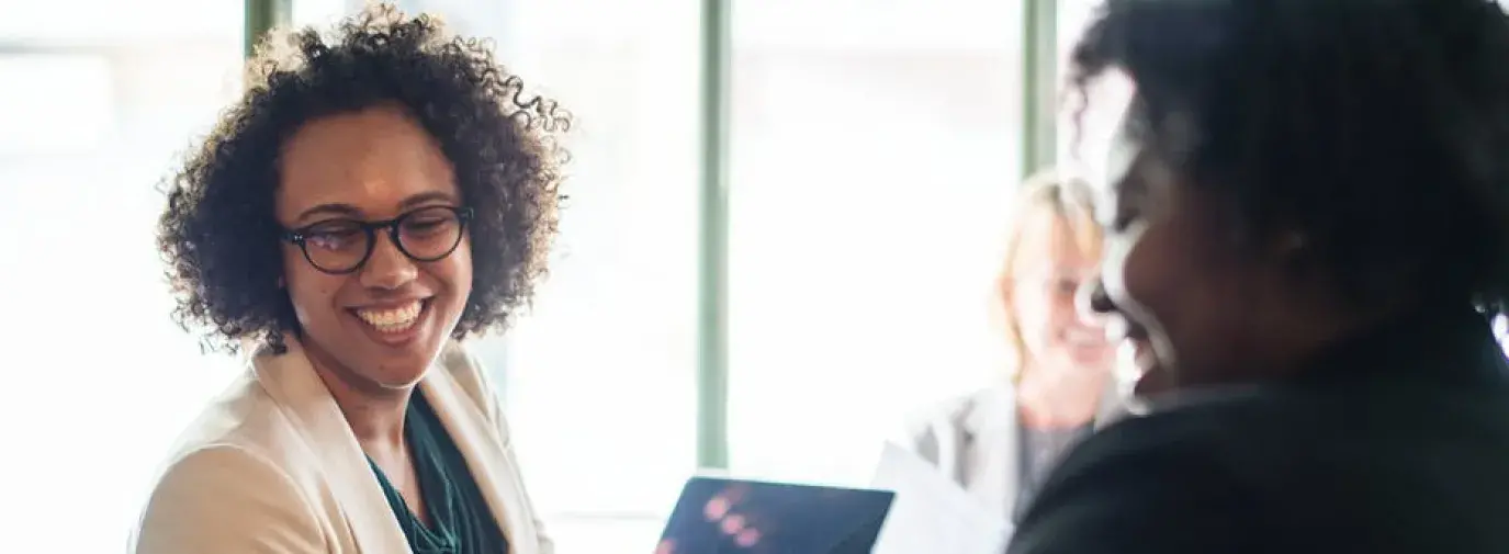 Image: African American women talking Topic: Supporting black-owned business