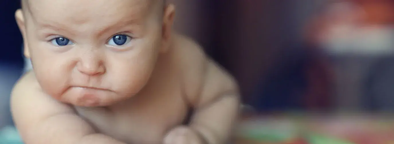 Image: baby looking grumpy. Topic: Carter's: End Toxic Textiles in Children's Clothing