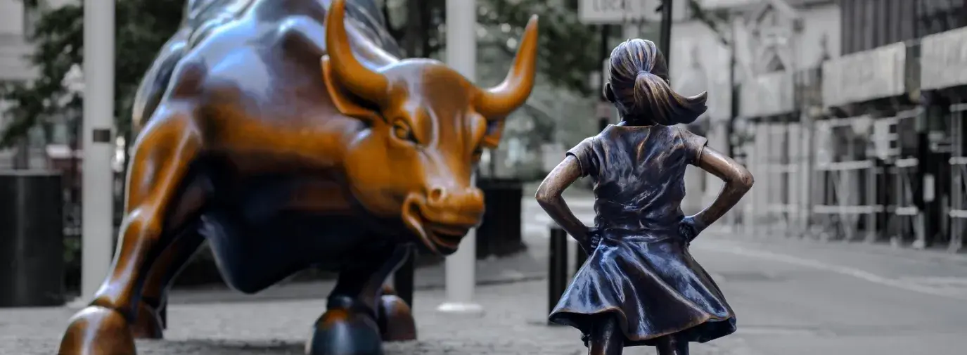 Fearless Girl facing Charging Bull Statue