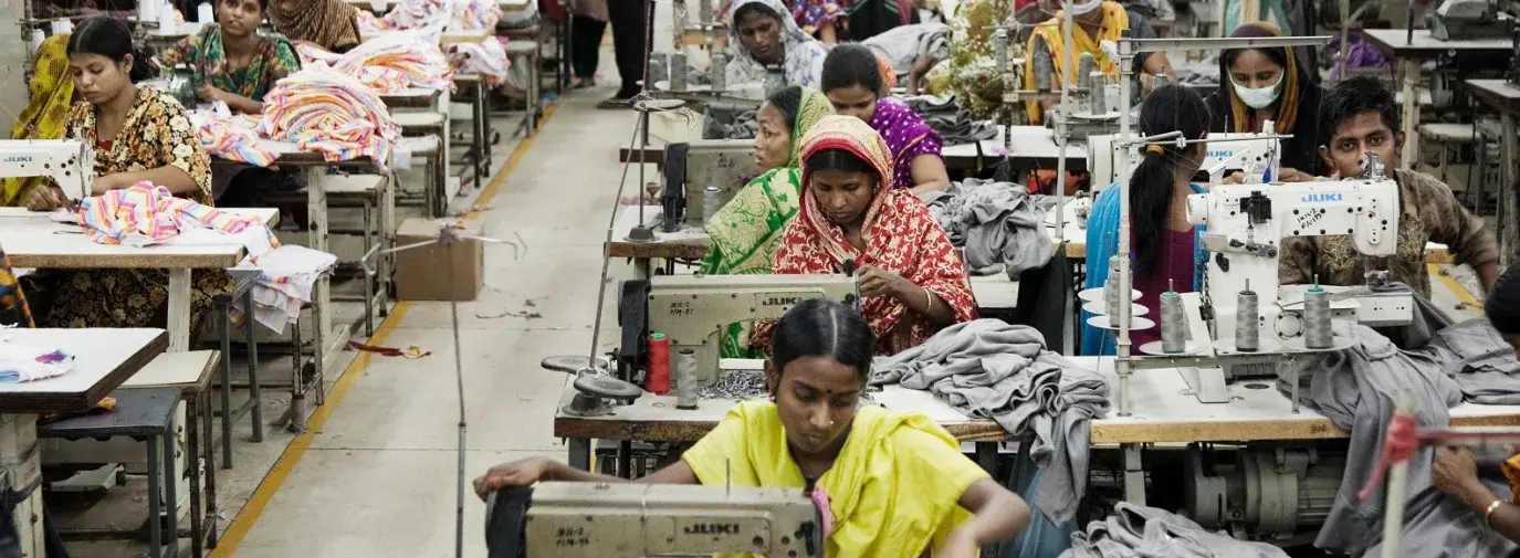 Image: factory garment workers in crowded room. Topic: Unpacking Toxic Textiles