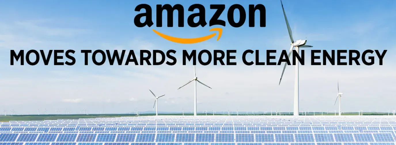 Image: solar panels and wind turbines with text overlay: Thanks to you taking action, Amazon moves towards more clean energy