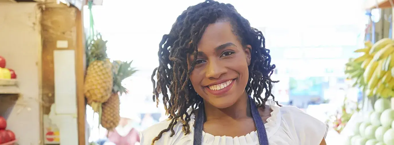 Image: woman with food. Title: Essential agriculture workers need our support during COVID-19