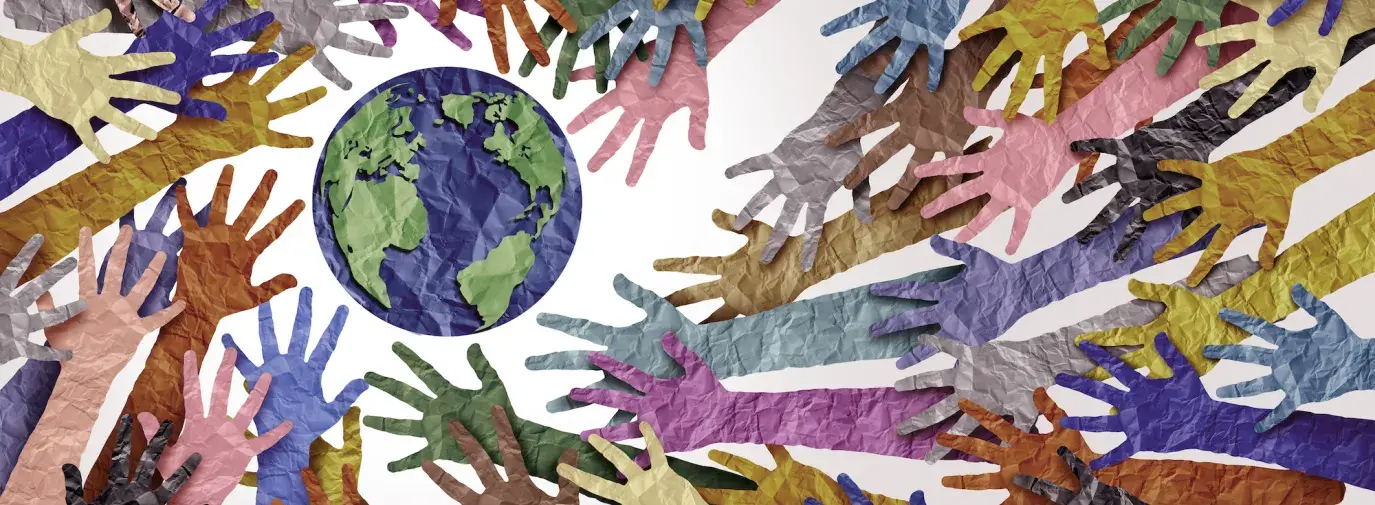 Image: multi-colored, paper hands around a globe. Topic: About Green America
