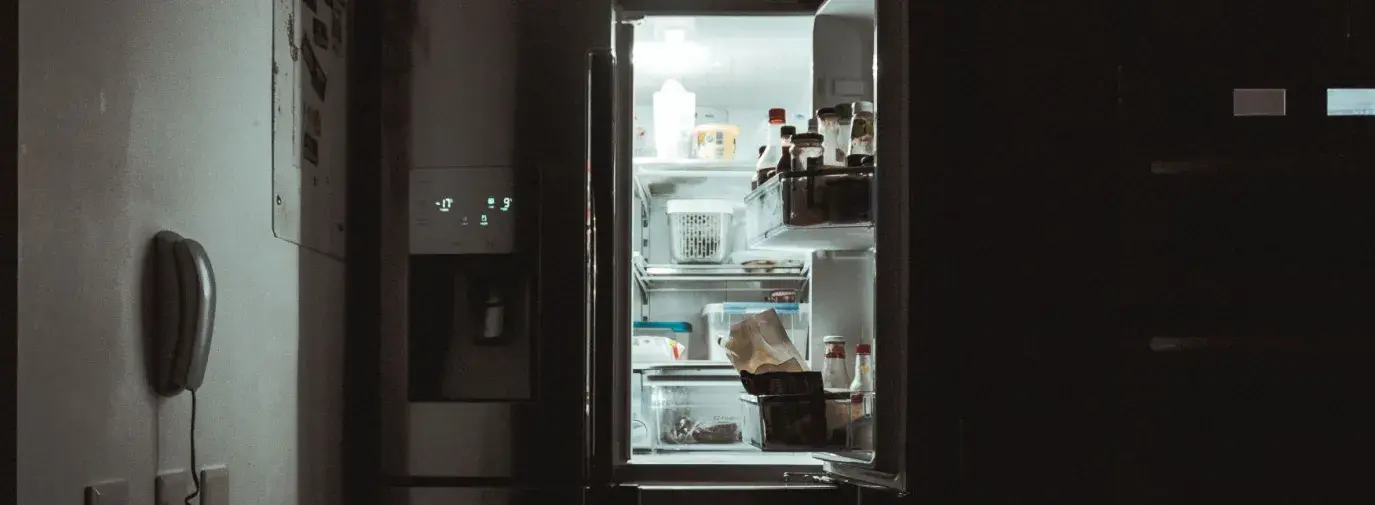 open refrigerator in the dark