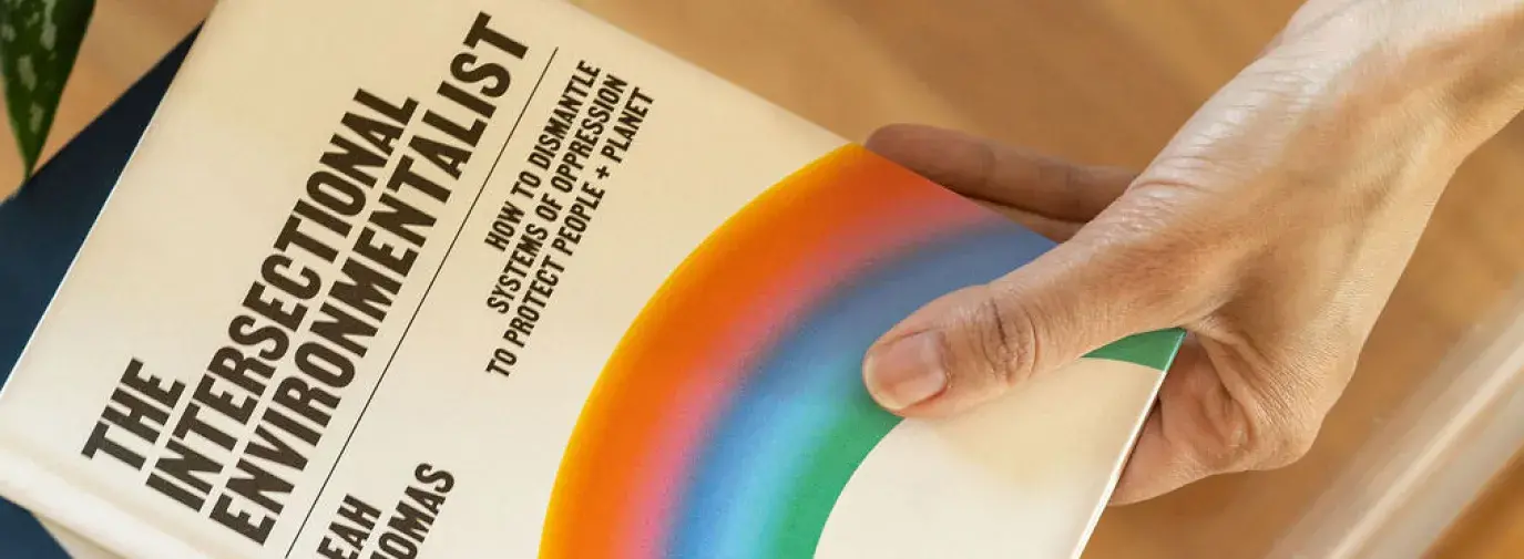 the intersectional environmentalist book sitting on a coffee table