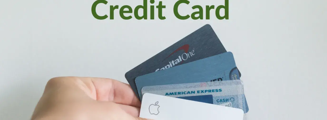Image: Hand holding several credit cards. Text: Why switch to a responsible credit card.