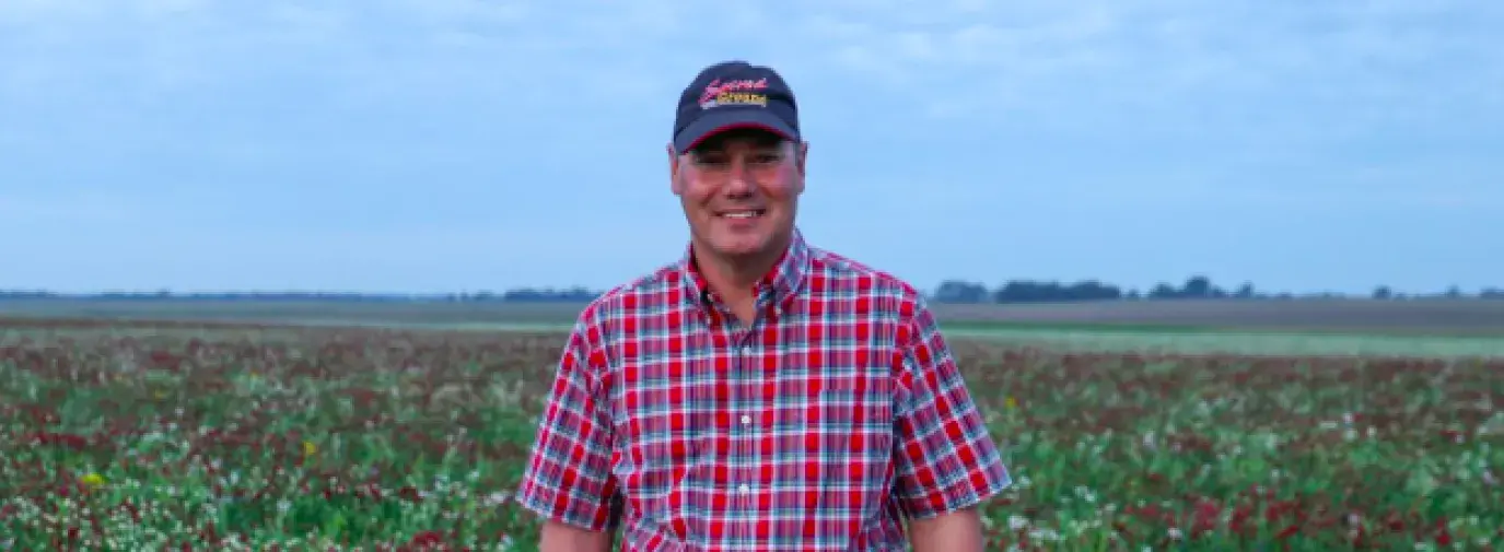 Image: Indiana farmer Rick Clark in field of crimson and balansa clover cover crops.
