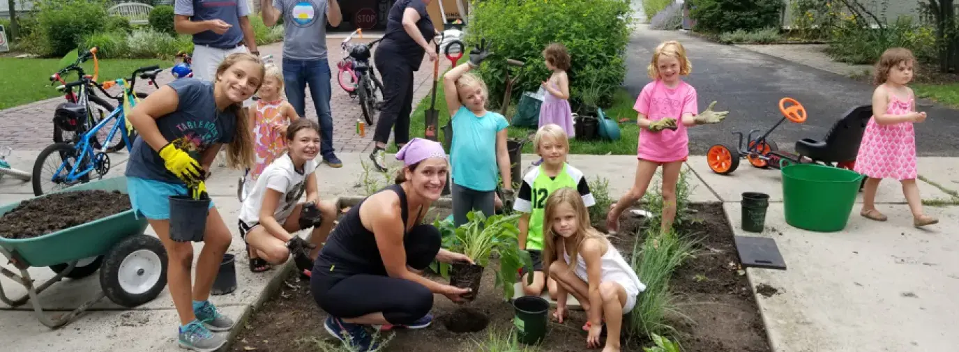 Parents and Children Planting a garden