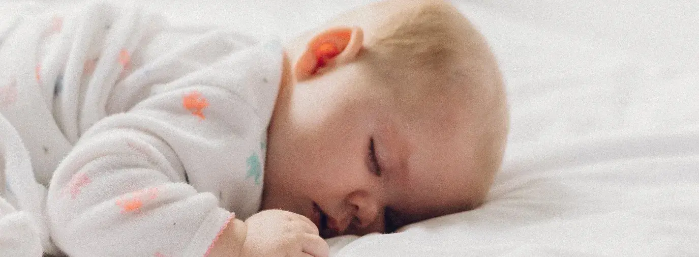 Image: baby sleeping. Title: Tell Carter's to End Toxic Textiles