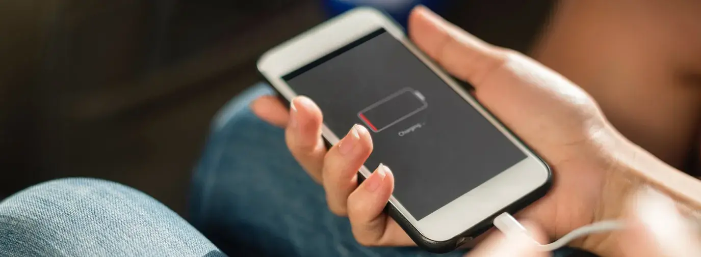 Image: person charging iPhone. Title: Apple Undercover Report