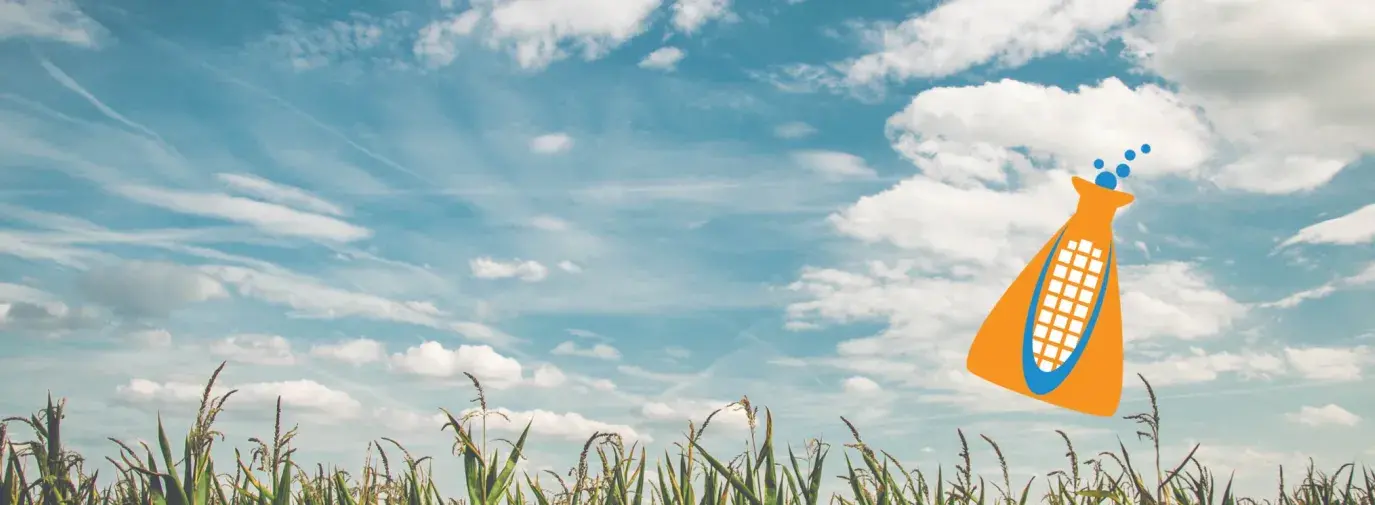 Image: green field, blue sky, cartoon lab vial in the sky. Topic: Genetic Engineering
