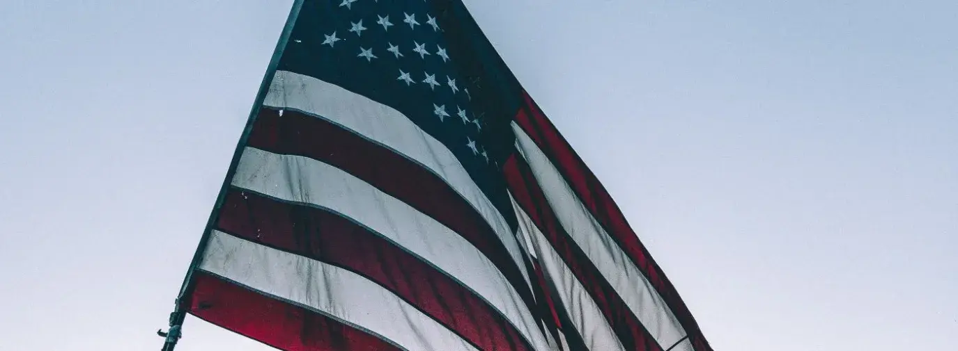 American Flag with Sunset in the Background