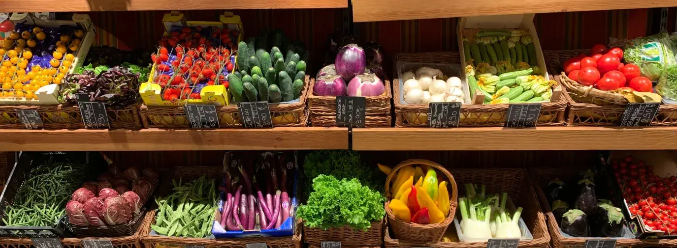 assorted fruits on brown wooden shelves