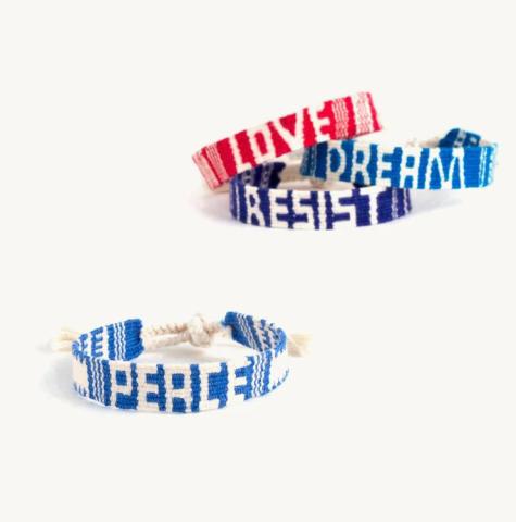 Woven bracelets with various words on them. Fair Trade Gift Guide.