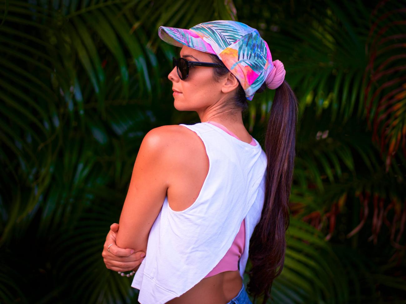 A woman wearing a colorful cap. Sustainable summer.