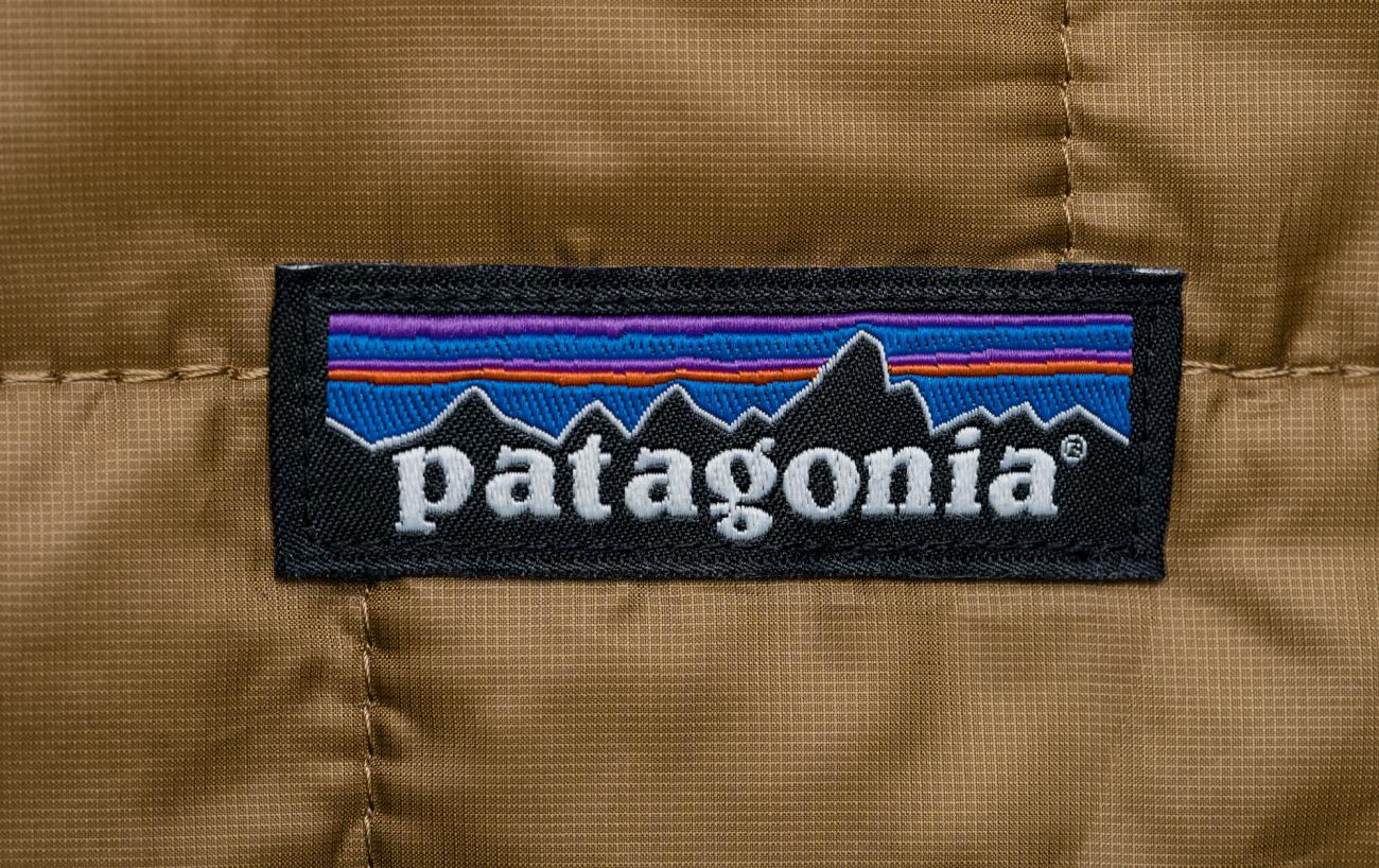 Patagonia patch on a piece of clothing; Patagonia is a business that tries to avoid greenwashing.