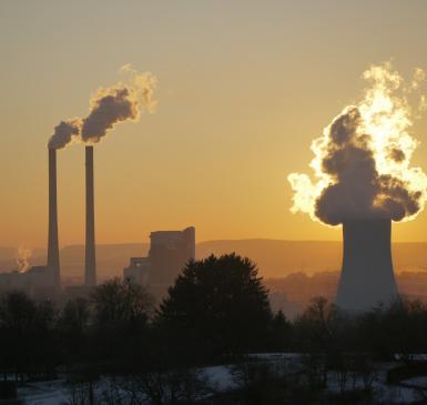Image: factory smokestacks and smog. Topic: Dirty energy.