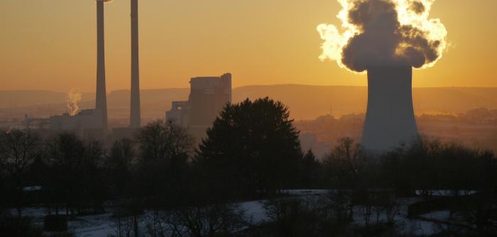Image: factory smokestacks and smog. Topic: Dirty energy.