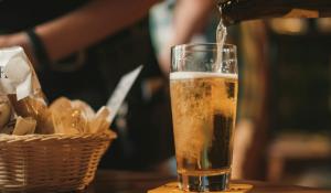 beer being poured into a cold pint glass. 