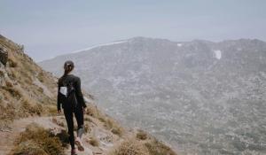 woman climbing a mountain