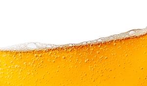 top of a glass of golden beer